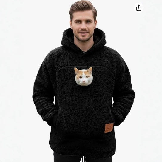Front view of black PawPocket hoodie with cat in kangaroo pouch